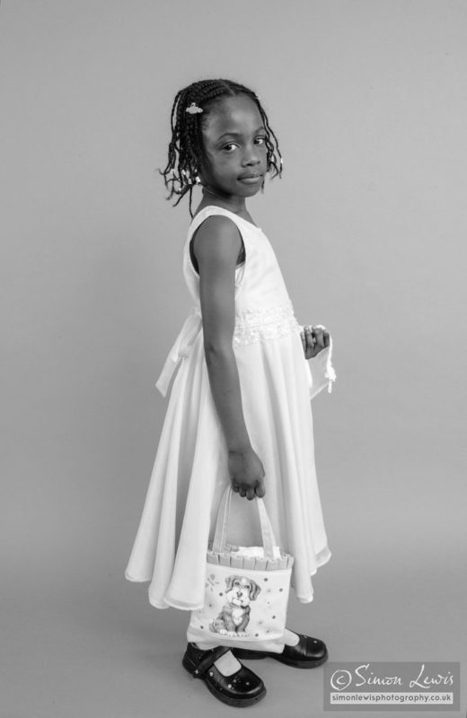 young black child with bag