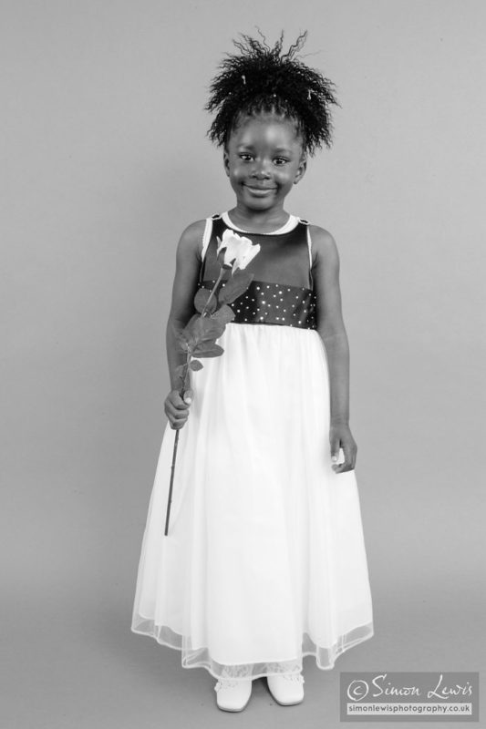 young black child with flower